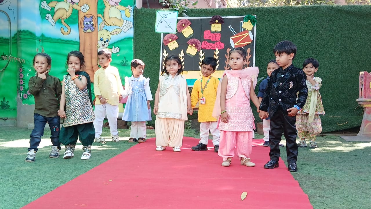 Kids in traditional outfits performing on cultural day