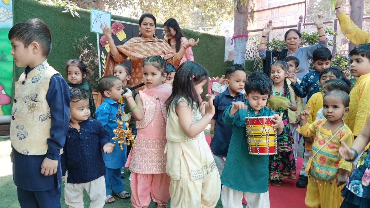 Kids in traditional outfits celebrating at Mom's Blessing